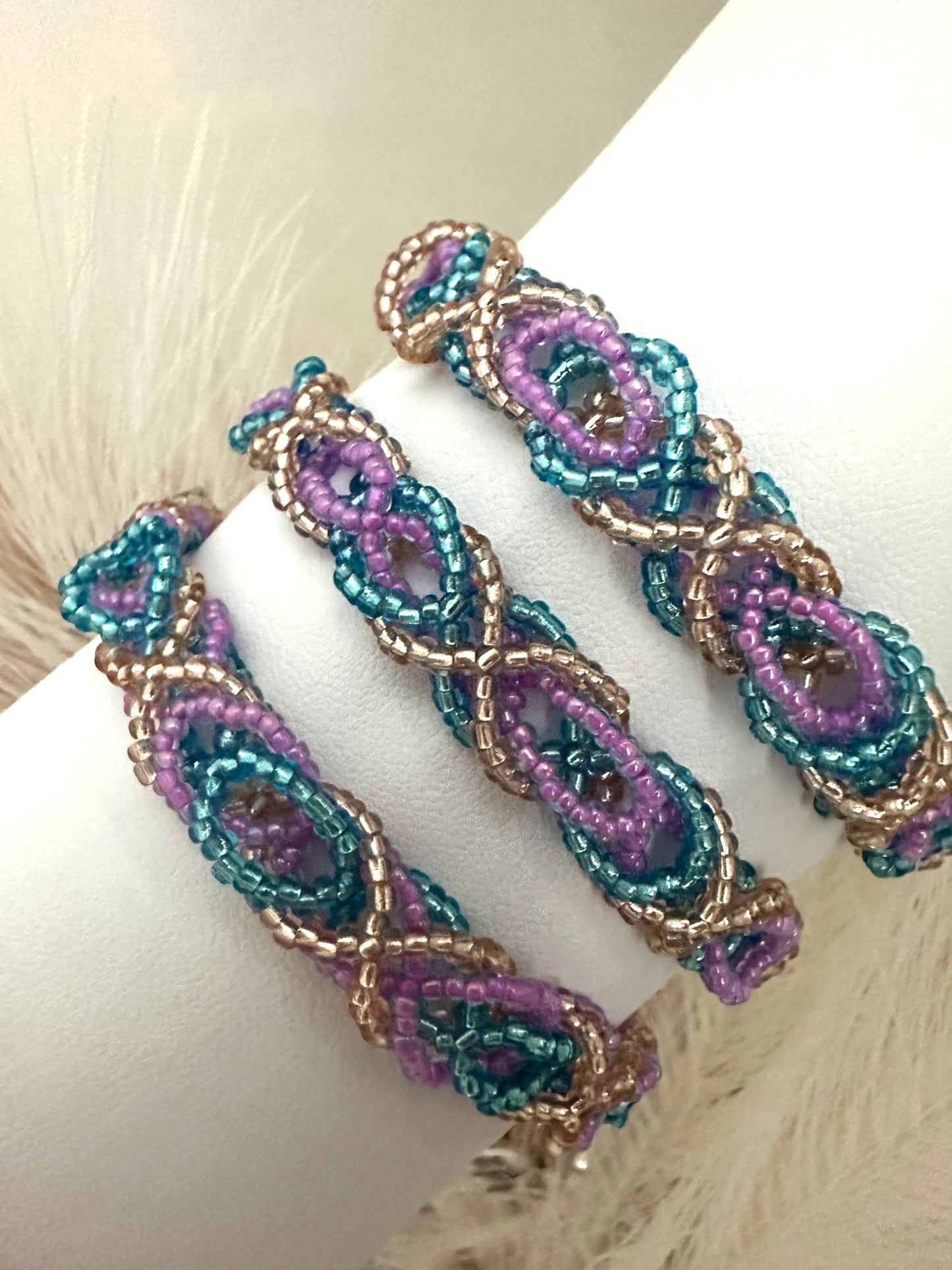 Handmade DREAM WEAVE braided bracelet with shiny lilac, blue, and bronze Miyuki beads and stainless steel clasp