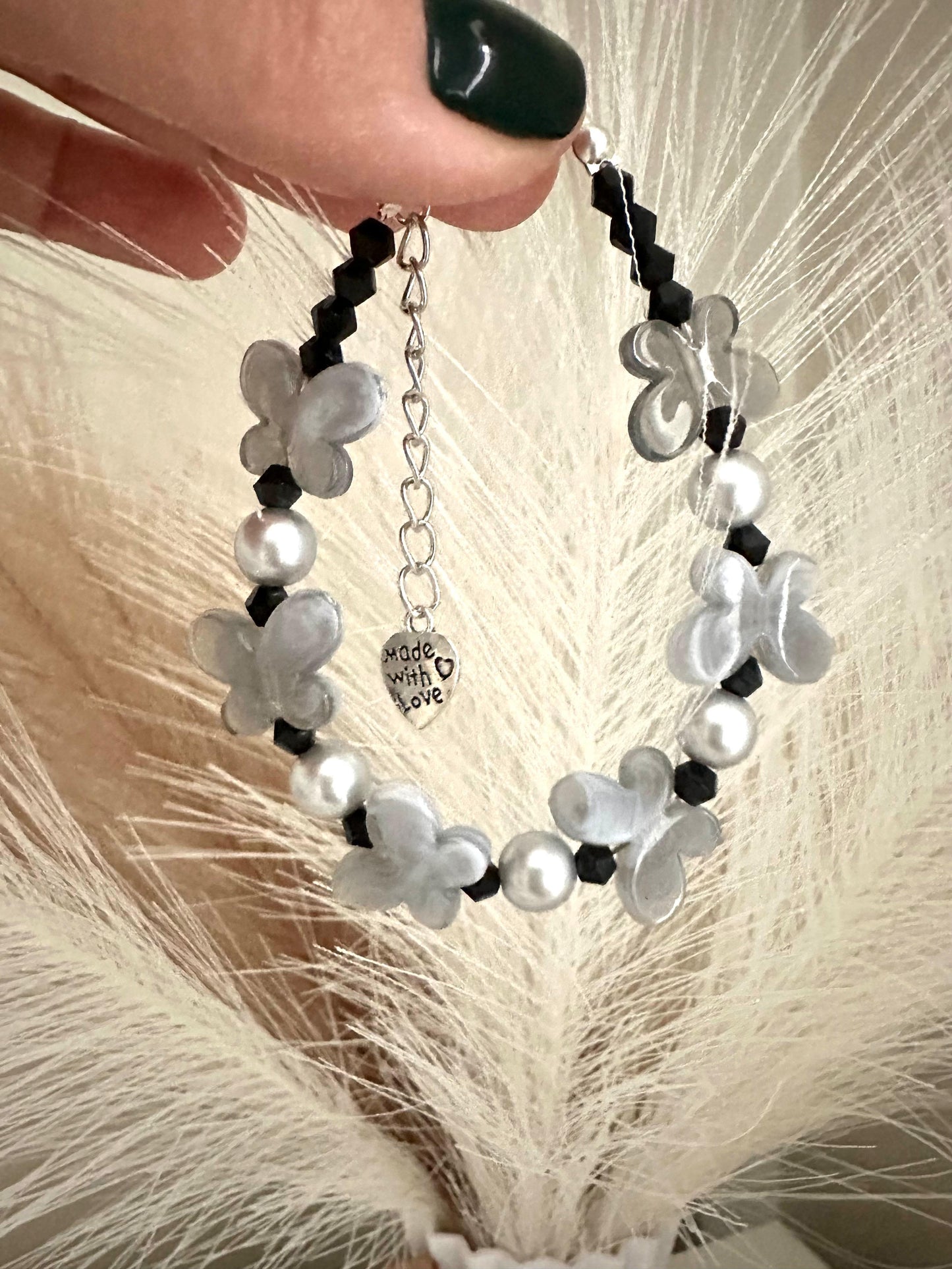 Handmade FLUTTERING Elegance bracelet with black crystal beads, grey faux pearl, and butterfly accents