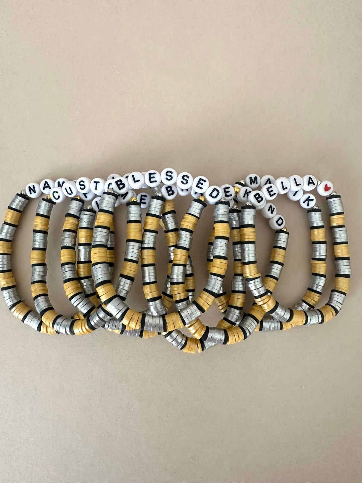 Personalized stretch bracelet with gold, silver, and black beads and customizable name letters