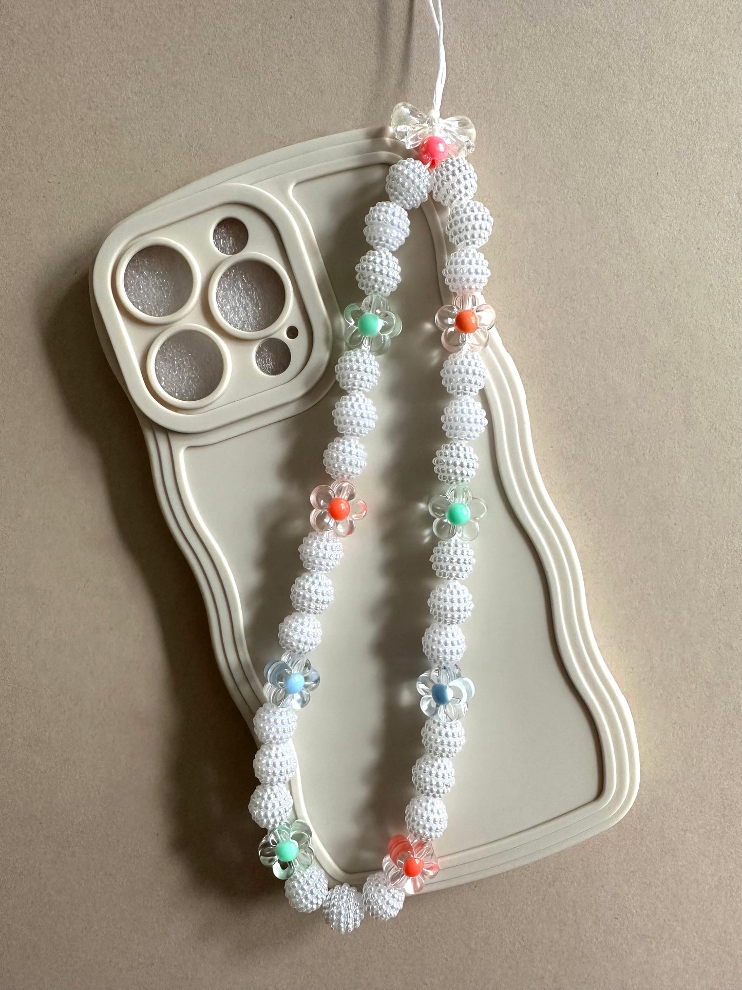 Handmade FLORAL ELEGANCE phone charm with beads, versatile accessory for phones, AirPods, keys, and bags