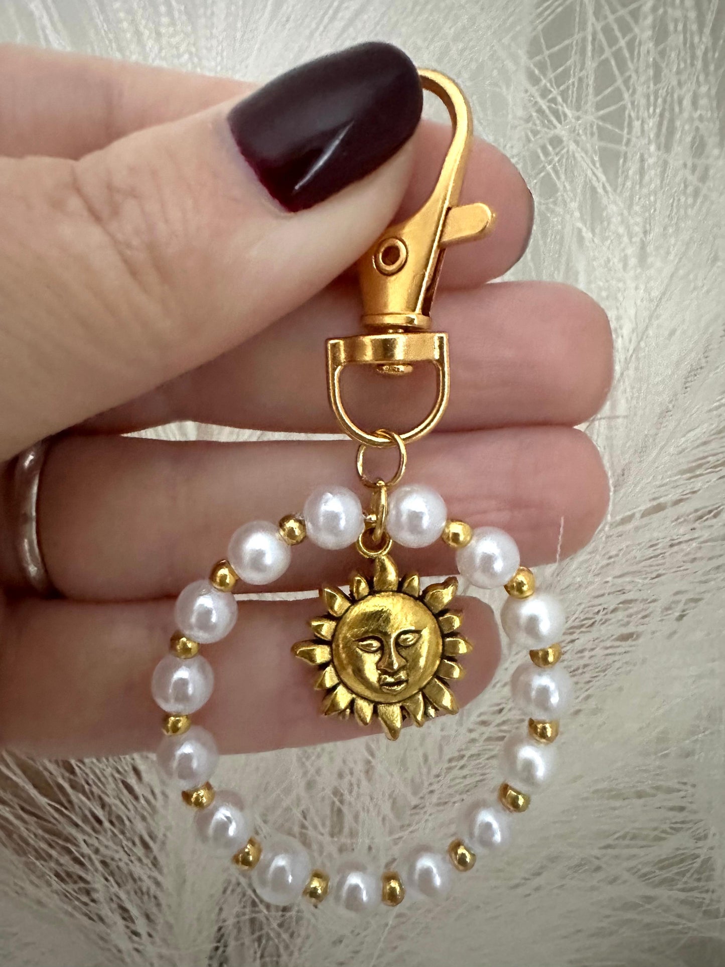 Handmade SUN PEARL golden keychain with white faux pearls and sun pendant