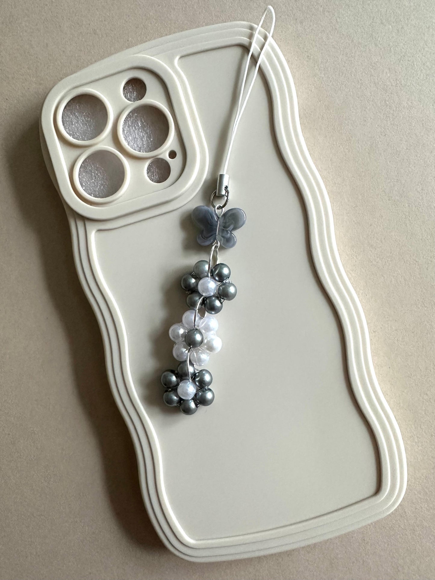 Handmade grey butterfly floral phone charm with faux pearls for versatile accessory use