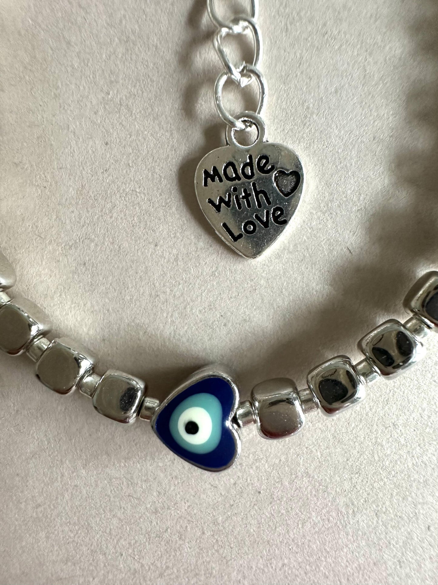 Handmade protective energy evil eye bracelet with silver beads and stainless steel clasp