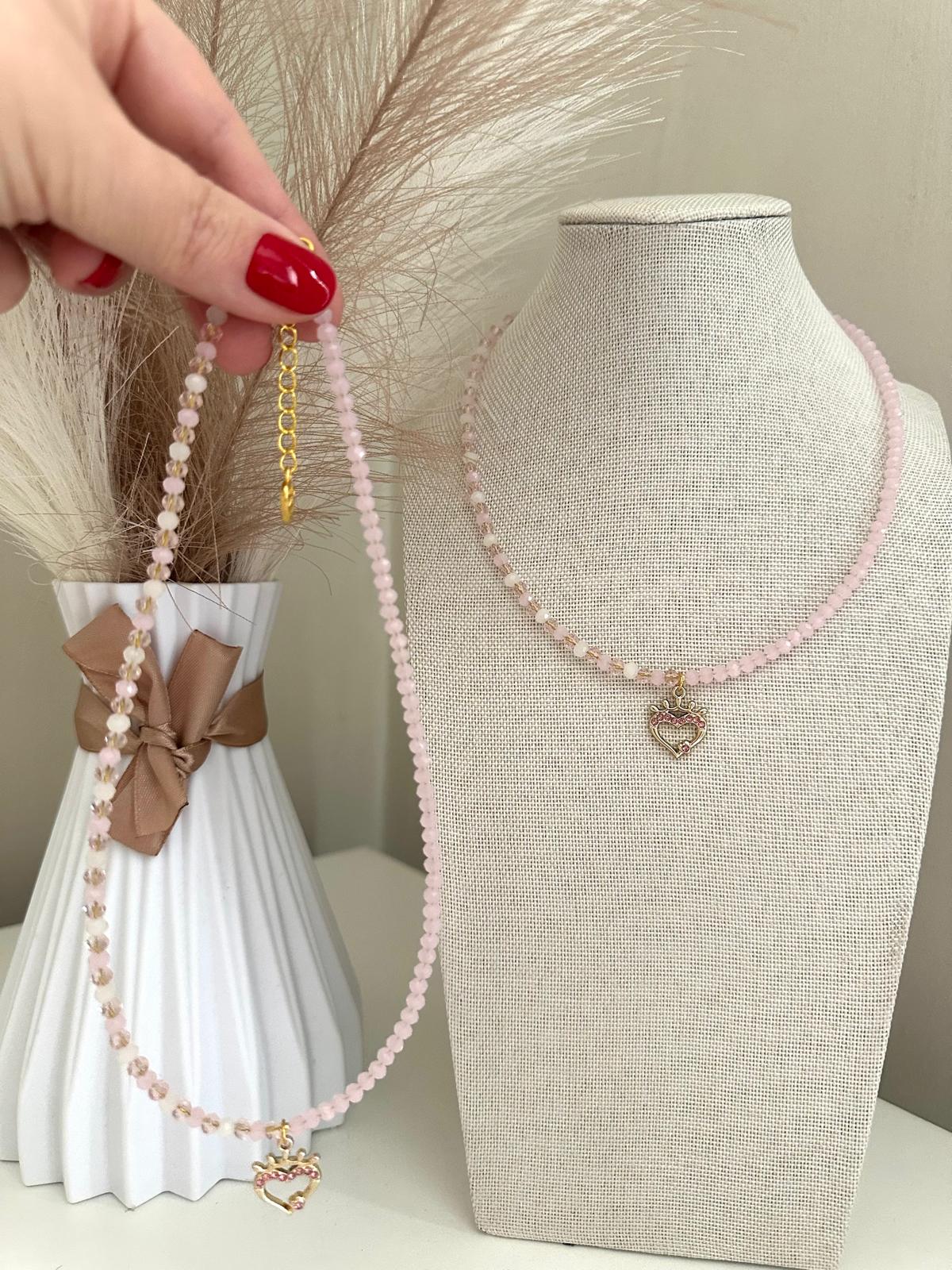 Pink heart handmade necklace with gold pendant and pink rhinestones on white and pink beads