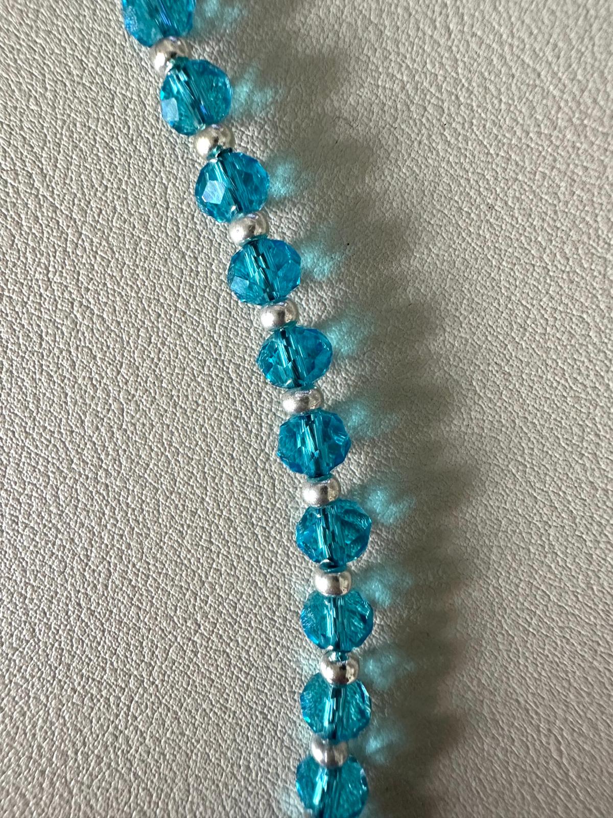 Handmade OLYMPIA necklace with blue crystal beads and silver circle pendant on adjustable chain