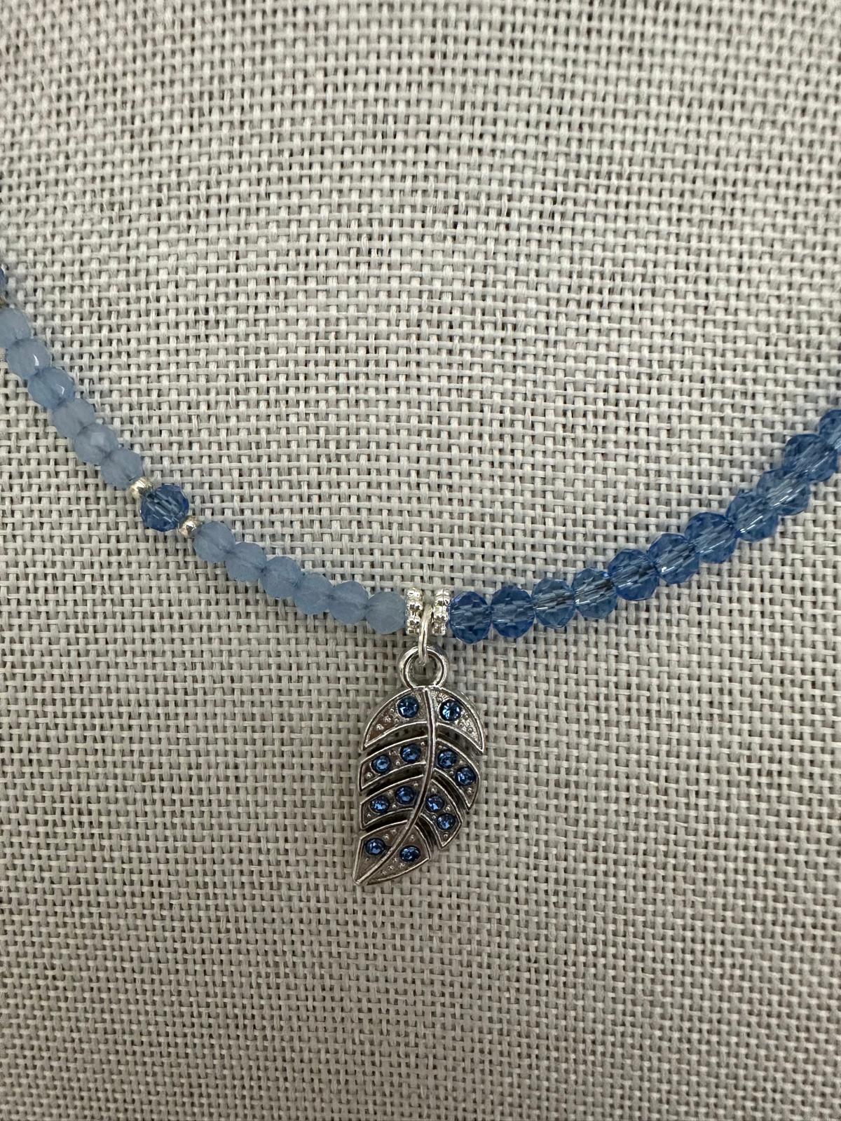 Handmade TESSA necklace with blue crystal beads silver rhinestone accents and silver leaf design