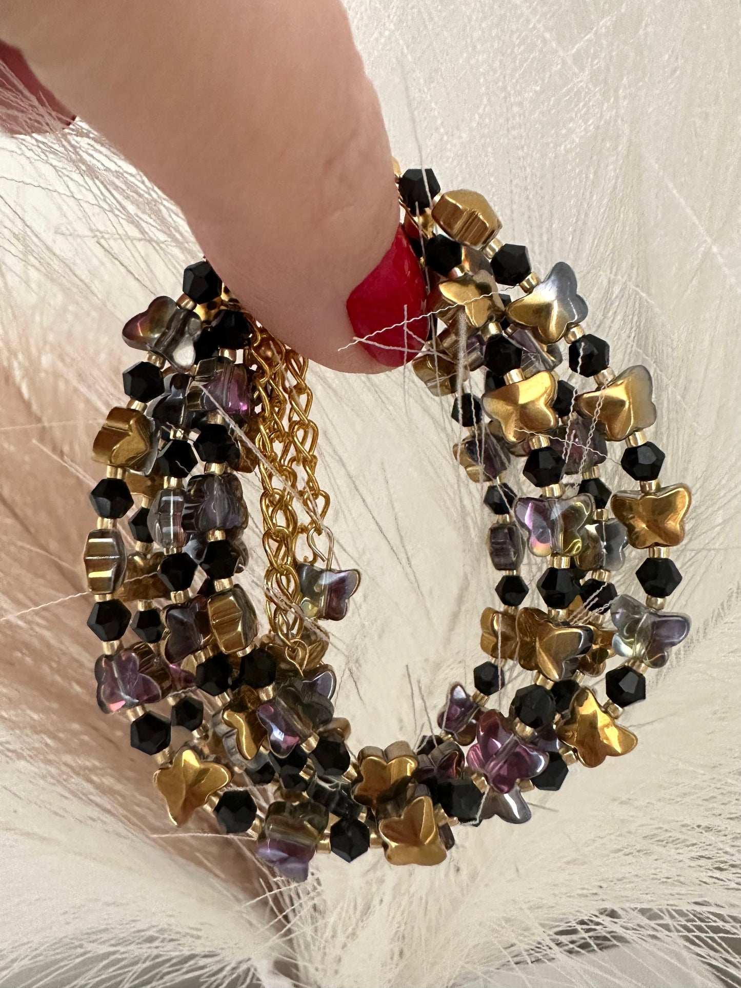 Handmade DARK FLIGHT bracelet with black and golden glass beads and 18K gold-plated chain