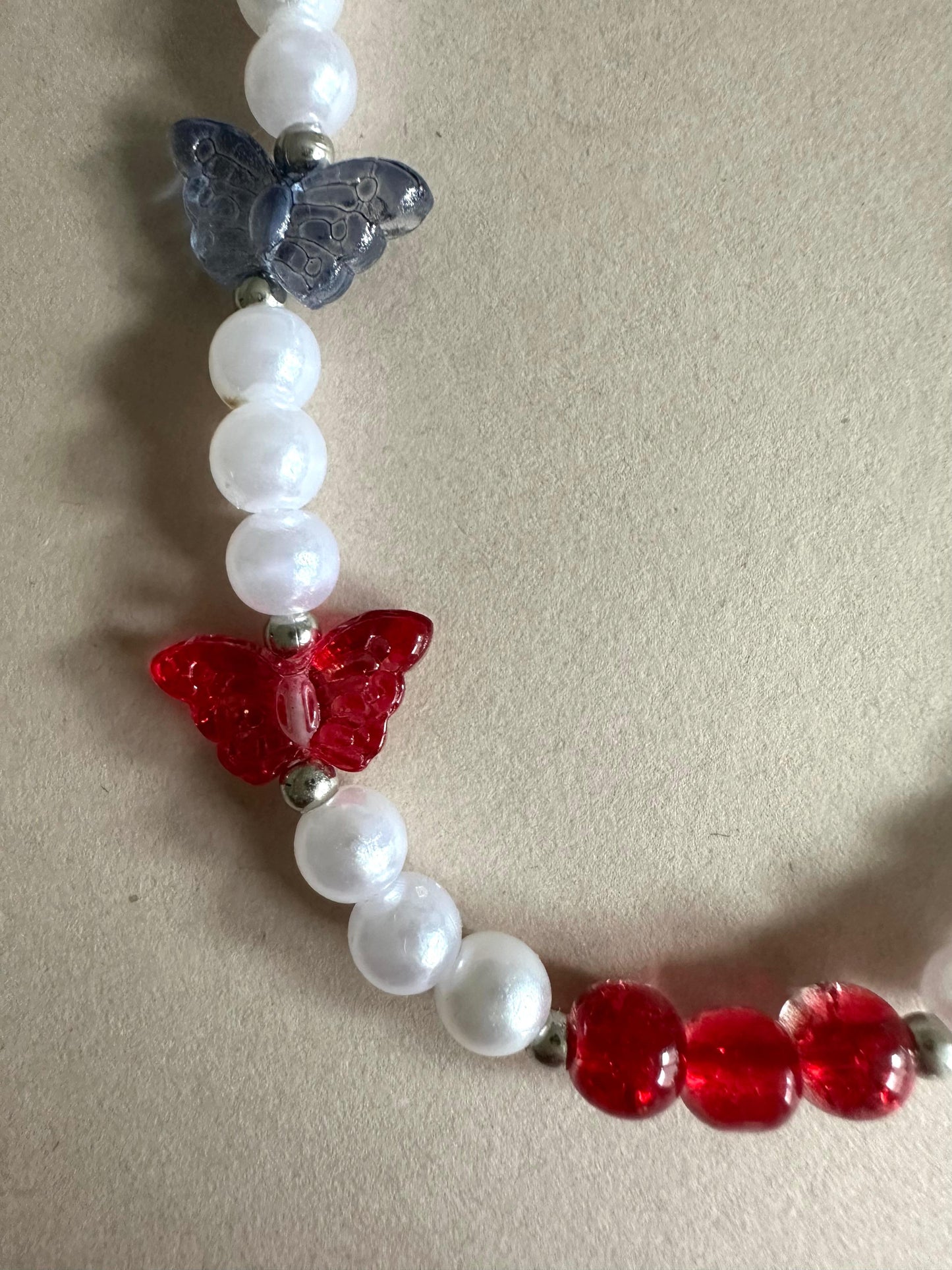 Handmade ethereal butterfly phone charm with faux pearls, versatile accessory for phones, AirPods, keys, and bags