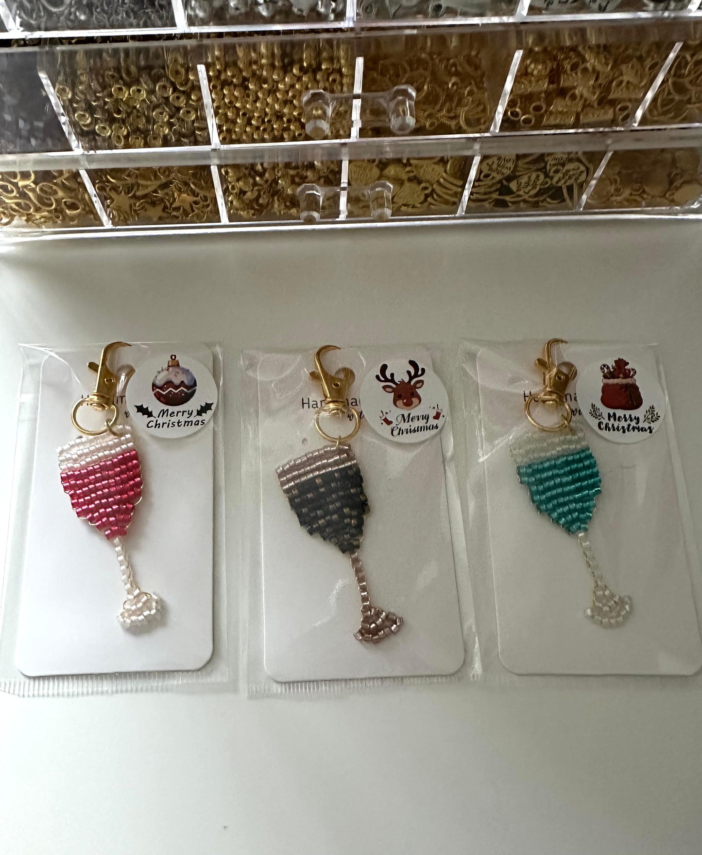 Handmade beaded champagne glass keychain with gold clasp in red, black, or green beads