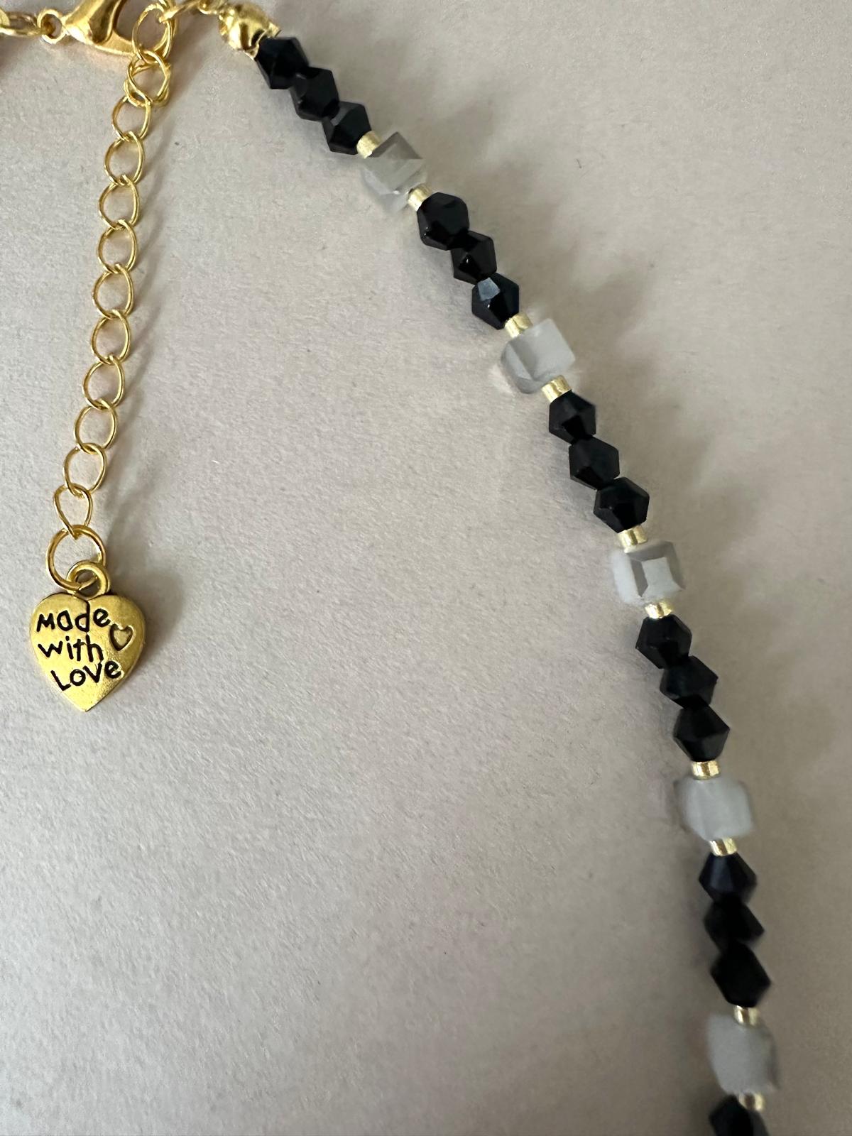 Handmade ECLIPSE ELEGANCE necklace with gray and black crystal beads and gold teardrop design