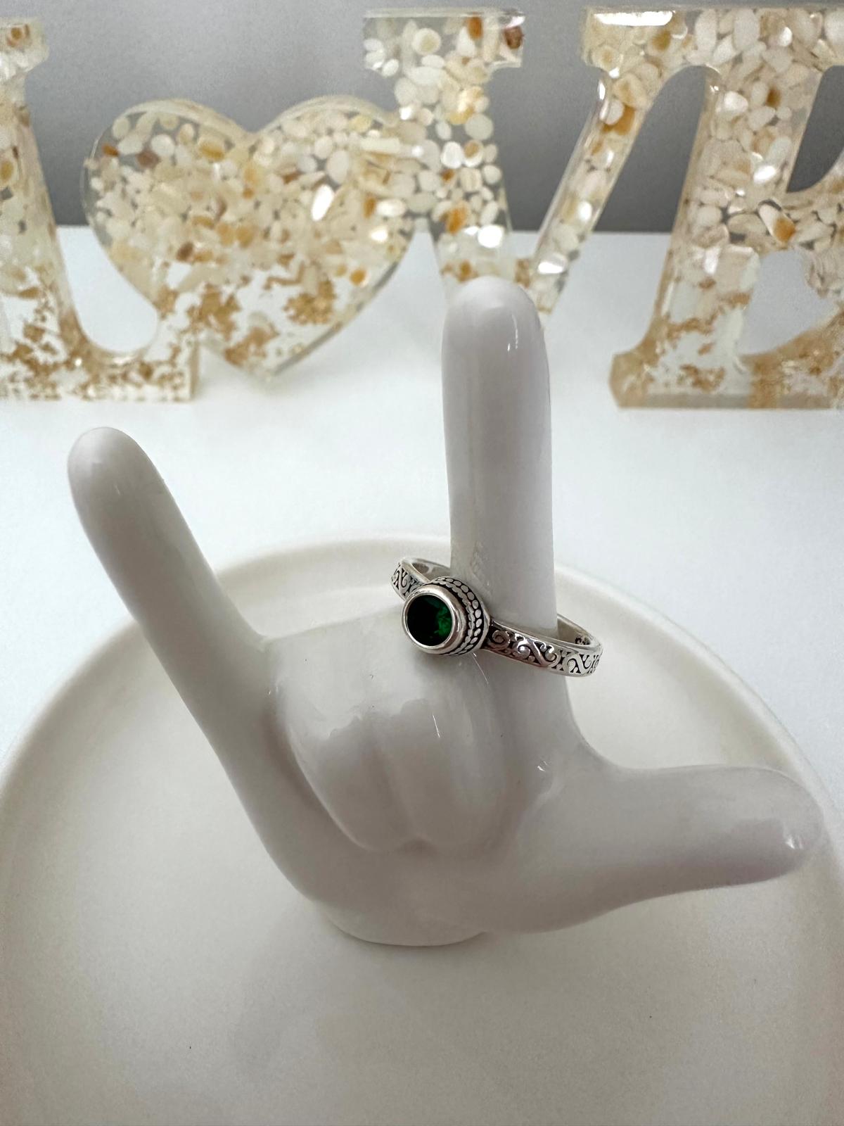 Adjustable sterling silver ring with emerald green gemstone and vintage scroll design