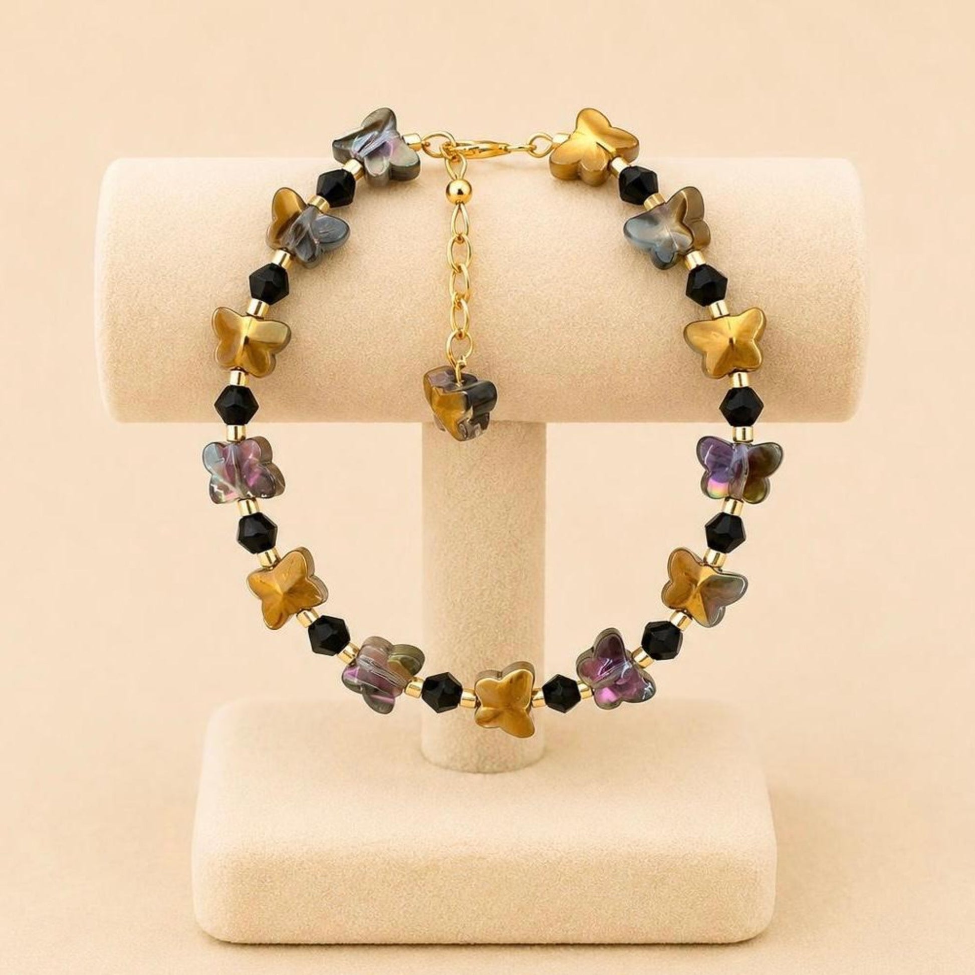 Handmade DARK FLIGHT bracelet with black and gold beads and 18K gold-plated chain