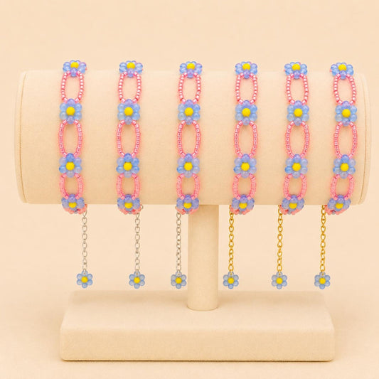 Handmade CORAL BLOOM bracelet with blue, yellow glass, and coral beads in gold or silver finish