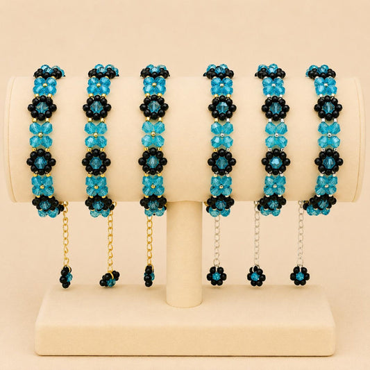 Turquoise Night Bloom handmade bracelet with black and turquoise beads in gold and silver options