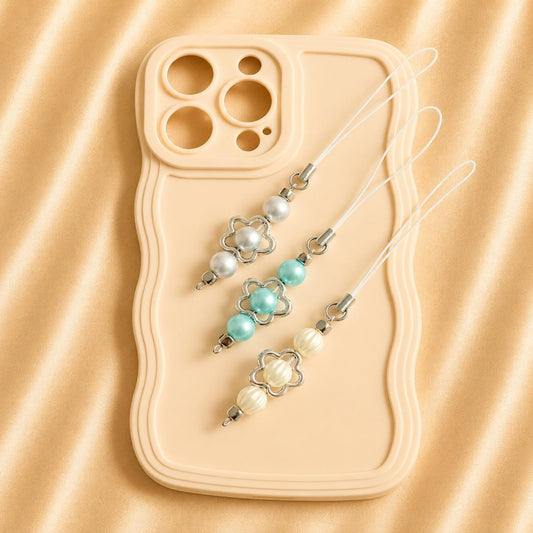 Handmade PEARL SKIES phone charm with customizable faux pearls in ivory, baby blue, and gray designs