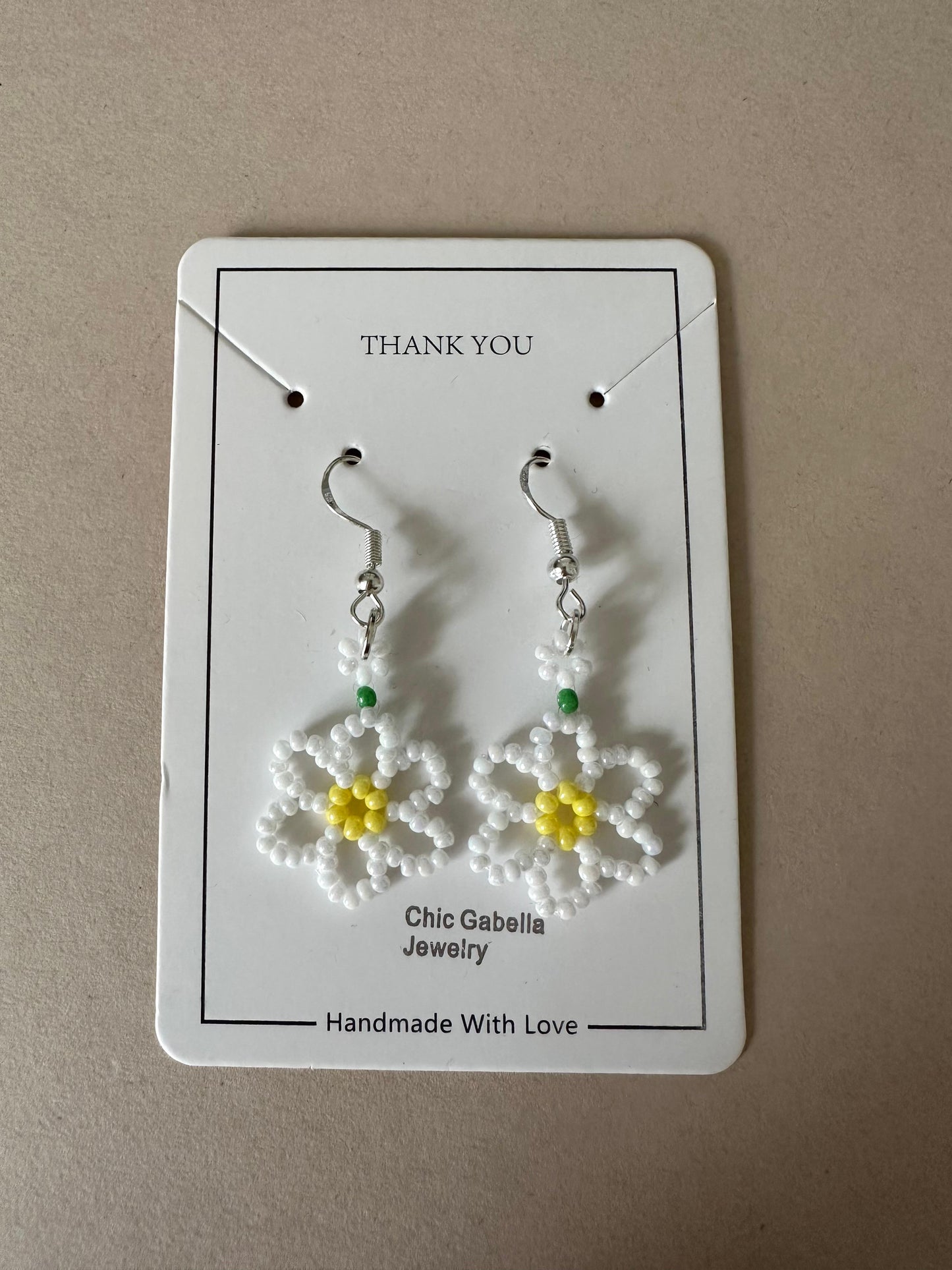 Delicate DAISY BLOOM silver earrings with white and sky blue floral bead design, lightweight and hypoallergenic