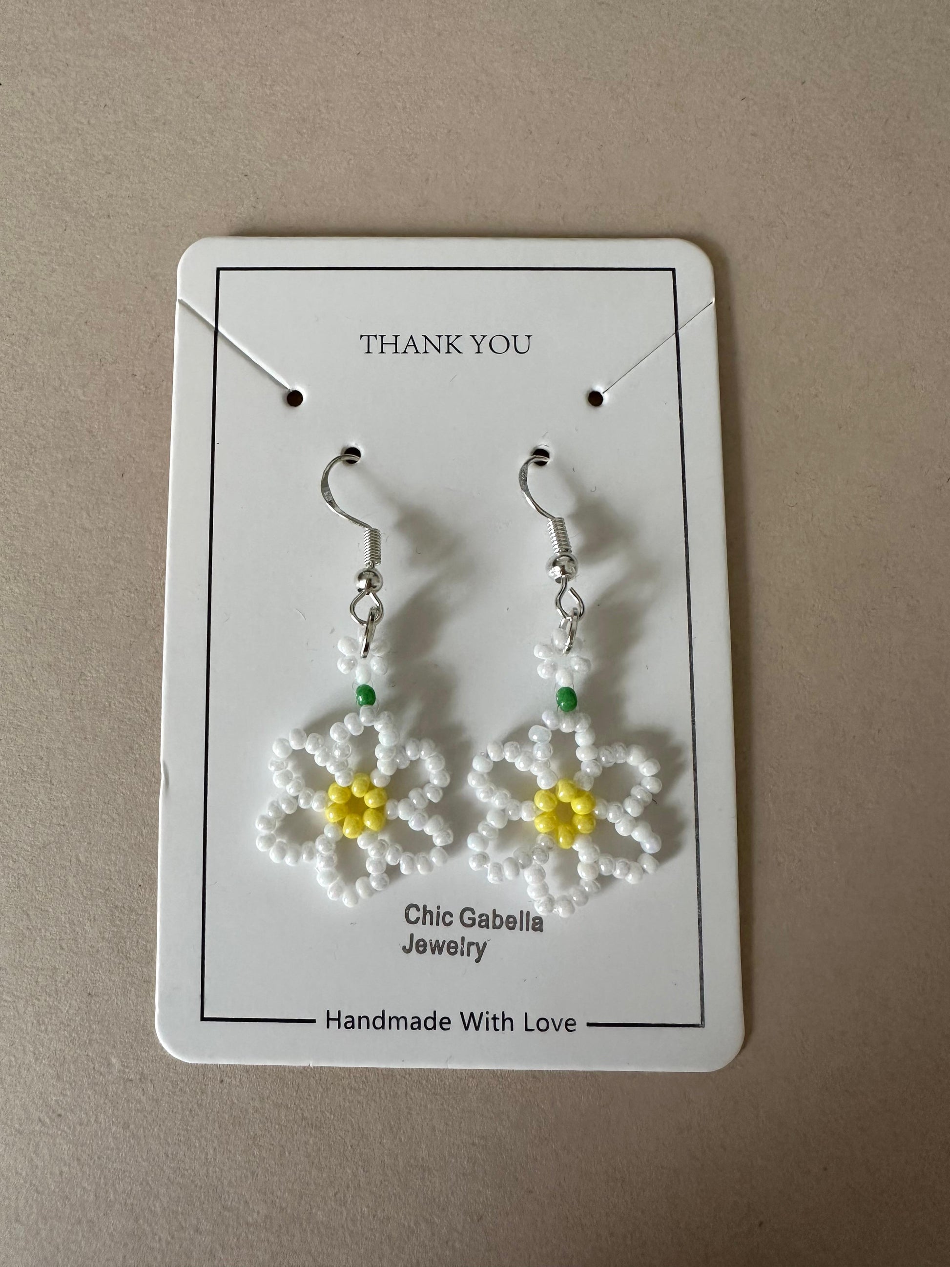Delicate DAISY BLOOM silver earrings with white and sky blue floral bead design, lightweight and hypoallergenic