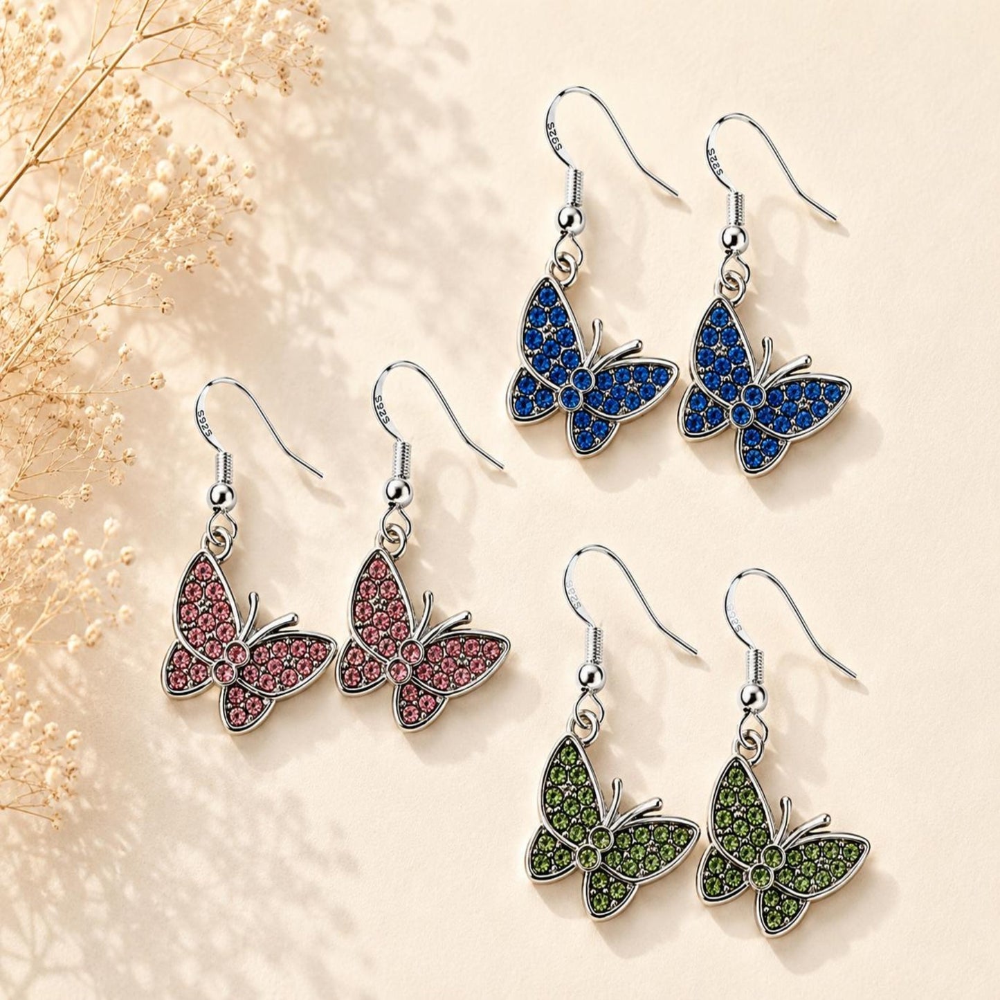 Handmade silver butterfly earrings with sparkling crystals and 925 sterling silver hooks for elegant everyday wear