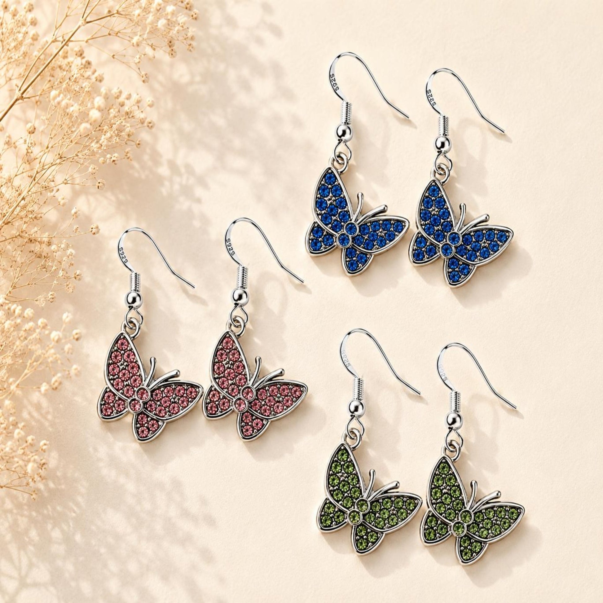 Handmade silver butterfly earrings with sparkling crystals and 925 sterling silver hooks for elegant everyday wear