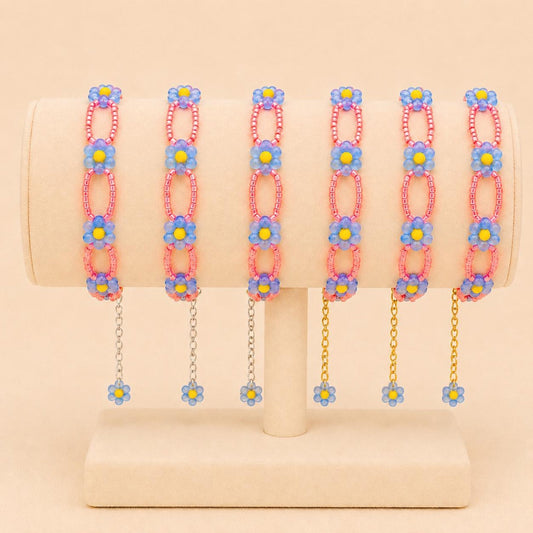 Handmade CORAL BLOOM bracelet with blue, yellow, and coral beads, gold and silver options