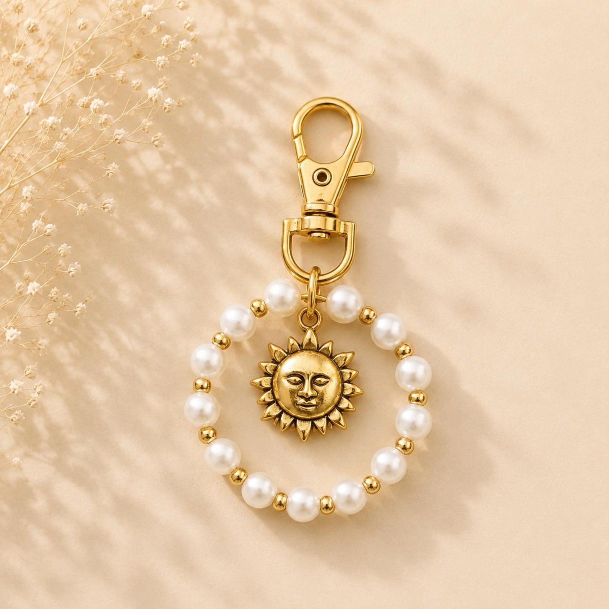 Handmade SUN PEARL golden keychain with white faux pearls and sun pendant