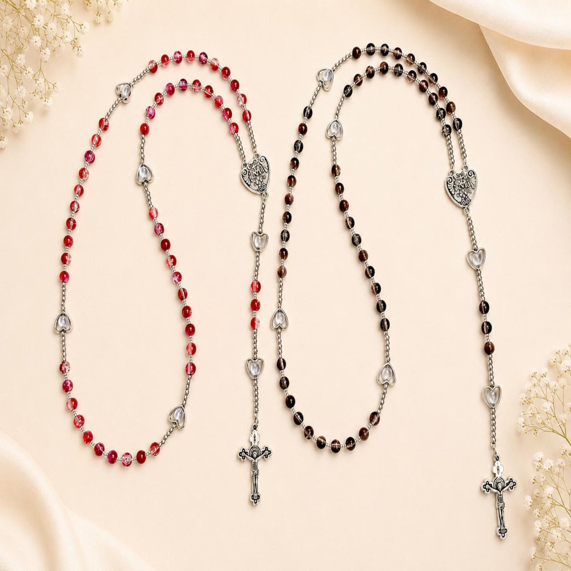 Handcrafted Sacred Grace rosary with red glass beads and silver heart-shaped accents for prayer and reflection