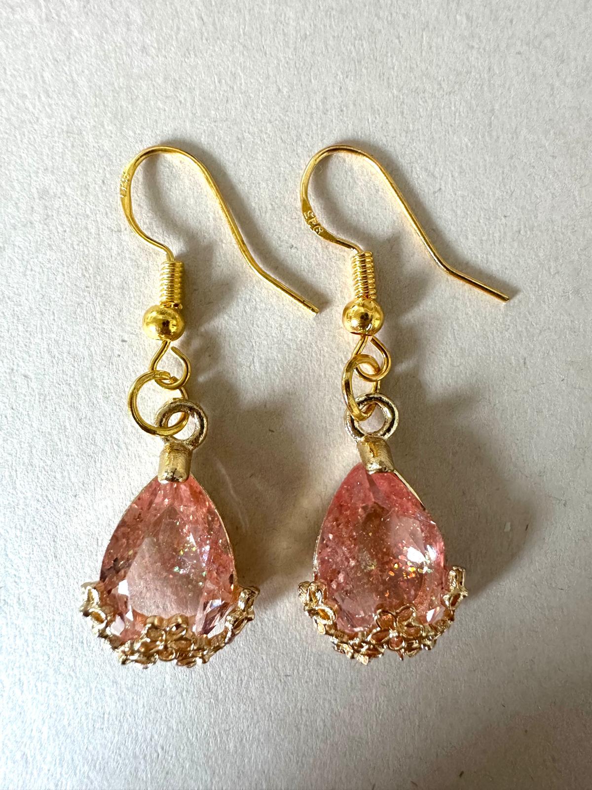 Handmade golden teardrop earrings with sparkling crystal on gold-plated hooks