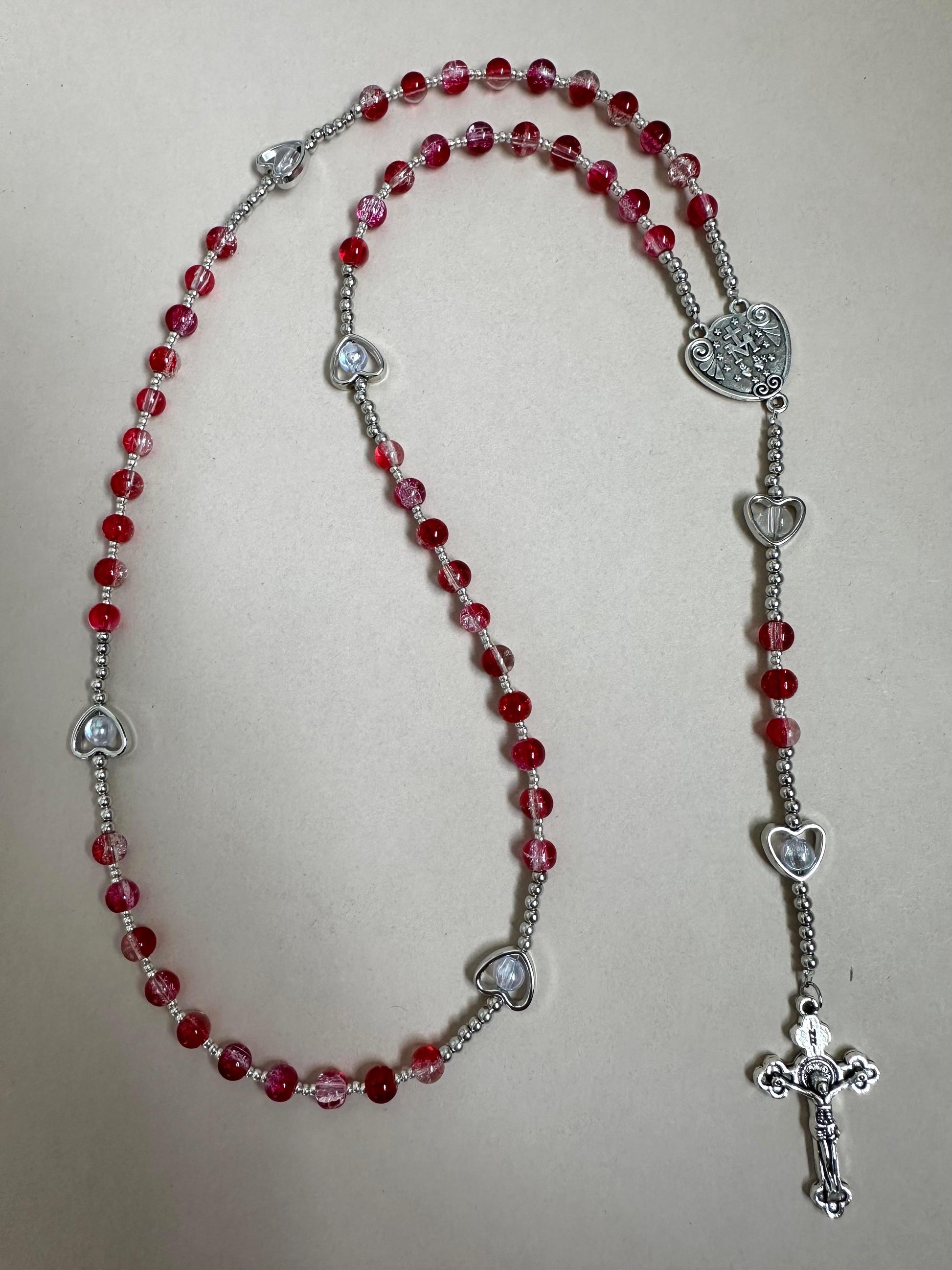 Sacred Grace Handmade Rosary with red glass beads and silver-tone heart-shaped accents