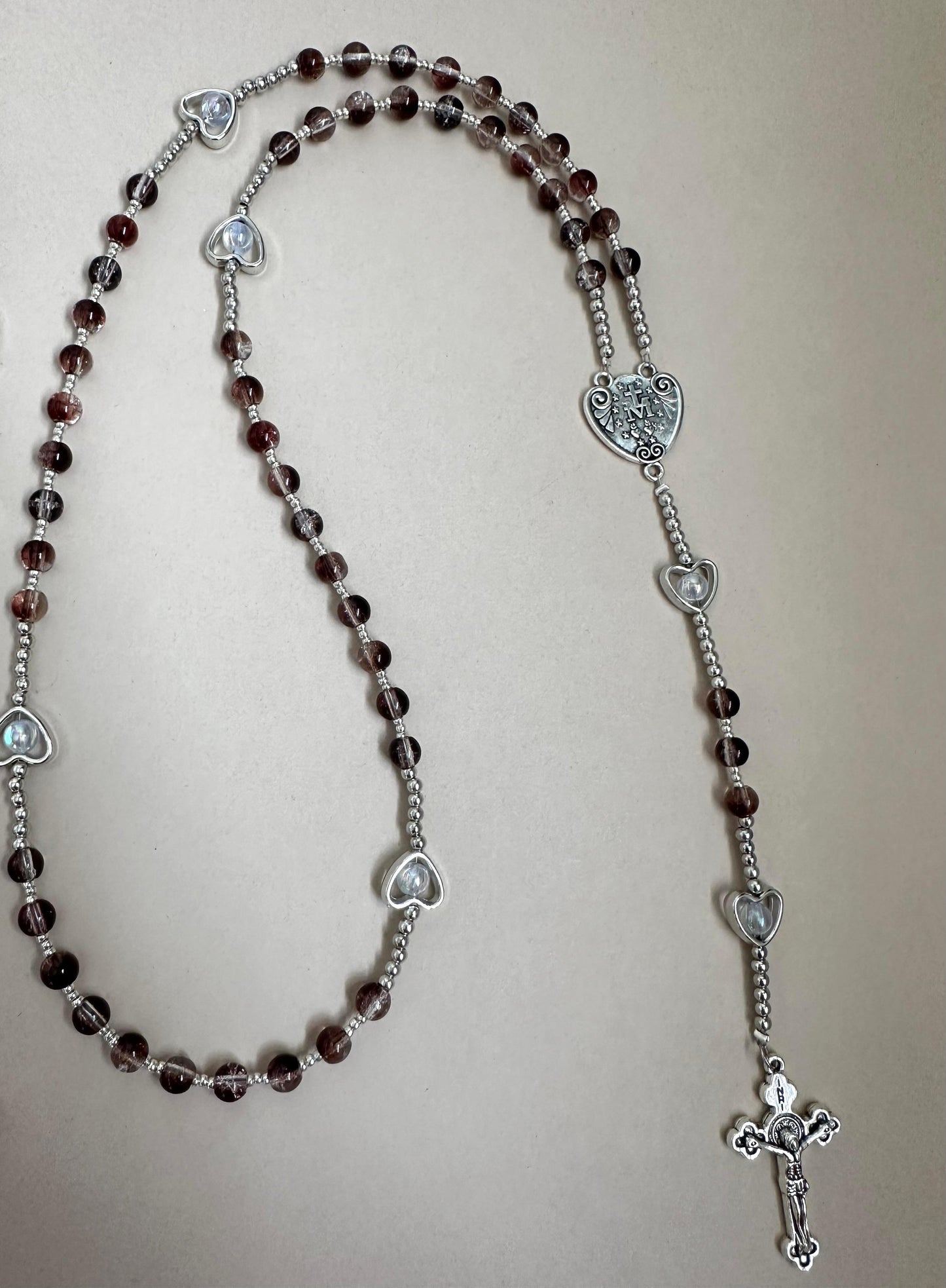 Sacred Grace Handmade Rosary with red glass beads and silver-tone heart-shaped accents