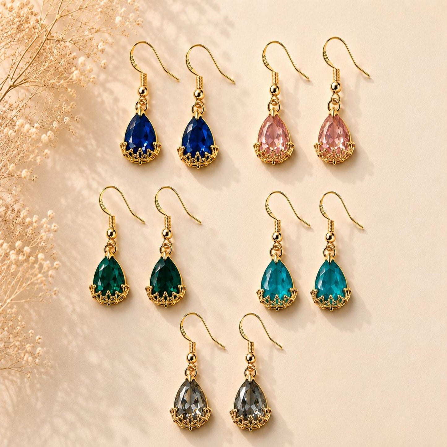 Handmade golden teardrop earrings with faceted crystal and 18K gold-plated hooks