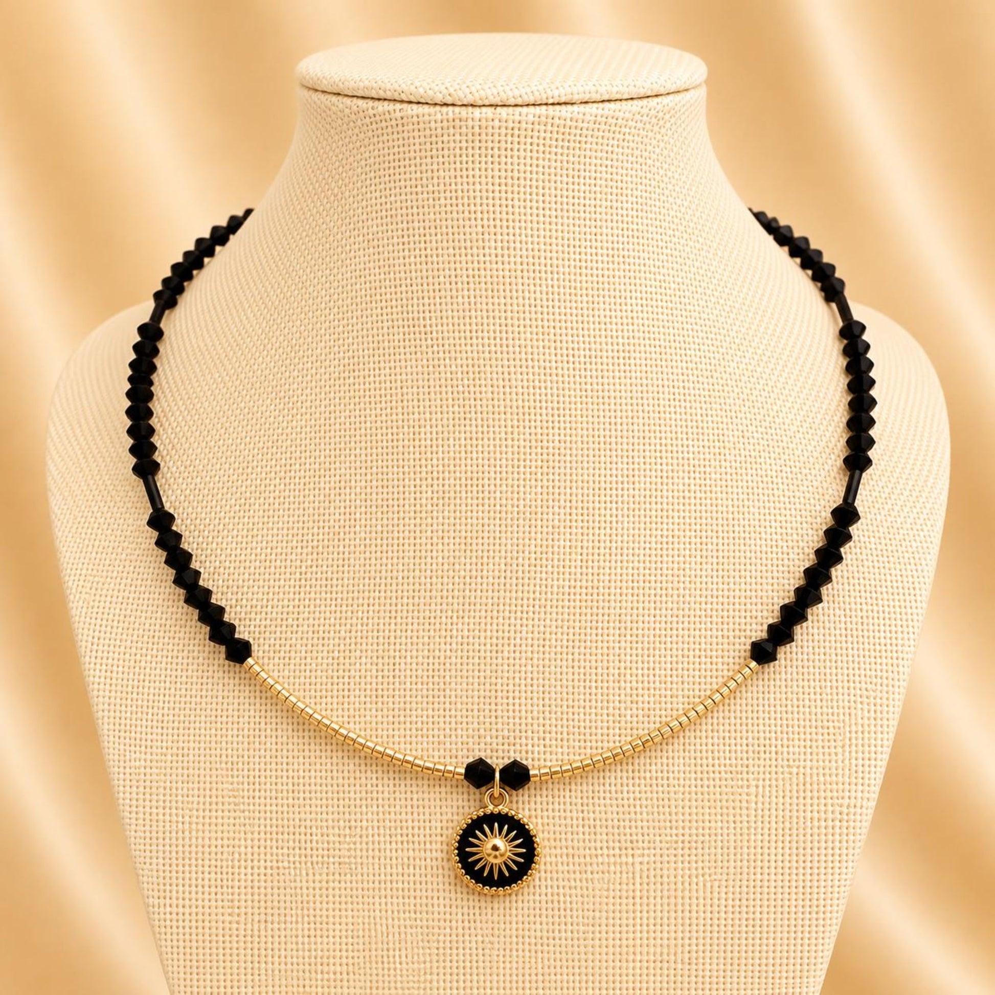 Handmade NOIR BEAUTY necklace with black crystal and gold beads on gold-plated chain