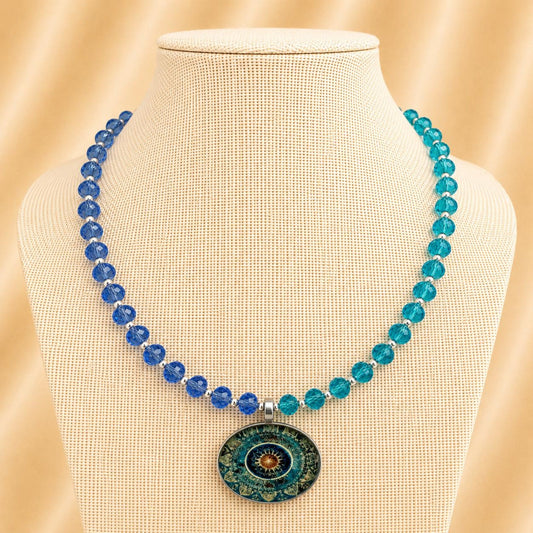 Handmade OLYMPIA necklace with blue crystal beads and silver circle pendant on adjustable silver chain