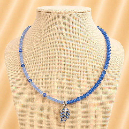 Handmade TESSA necklace with blue crystal beads, silver rhinestones, and leaf design on stainless steel chain