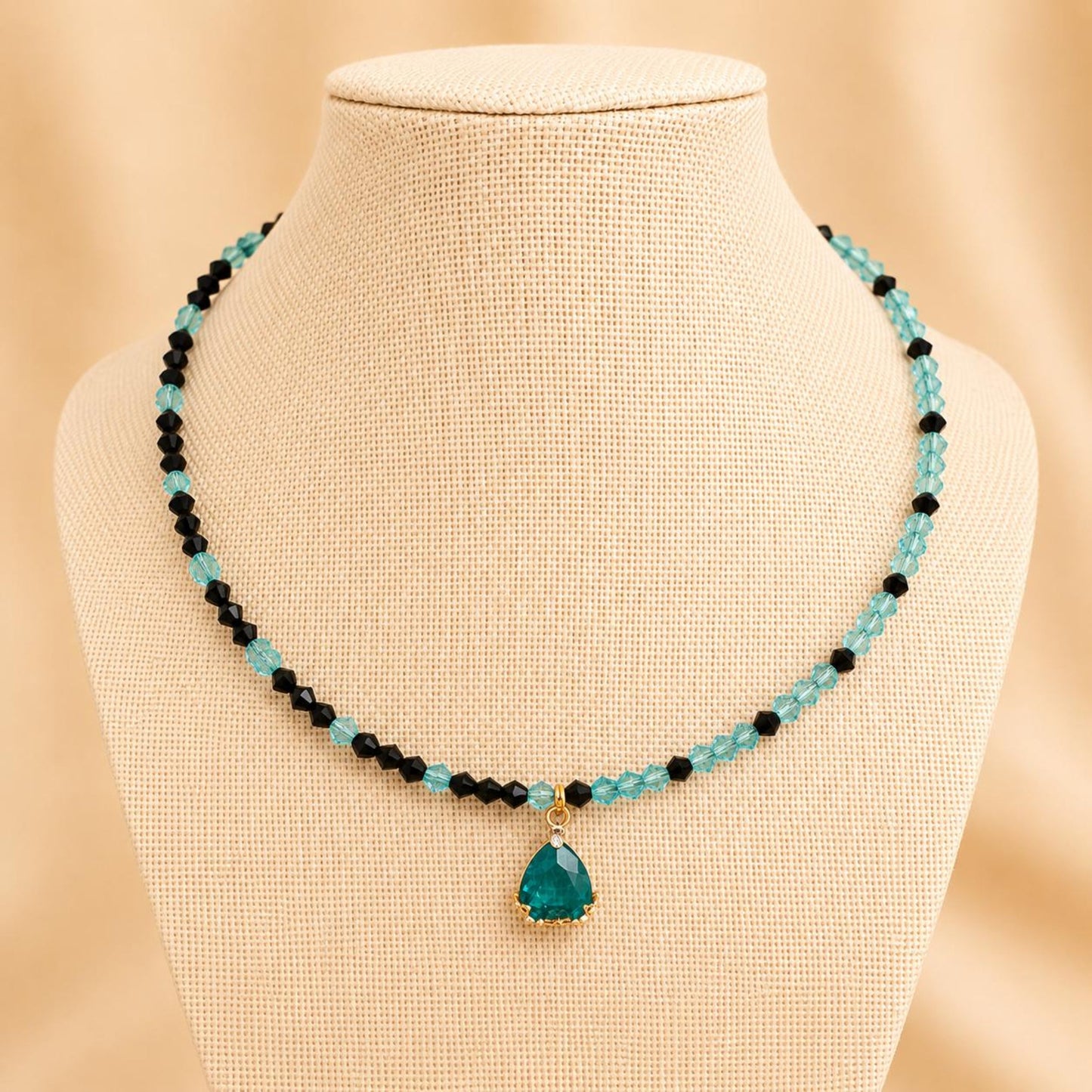 Handmade AIMEE necklace with dark turquoise and black crystal beads, gold teardrop design, 18K gold plated chain