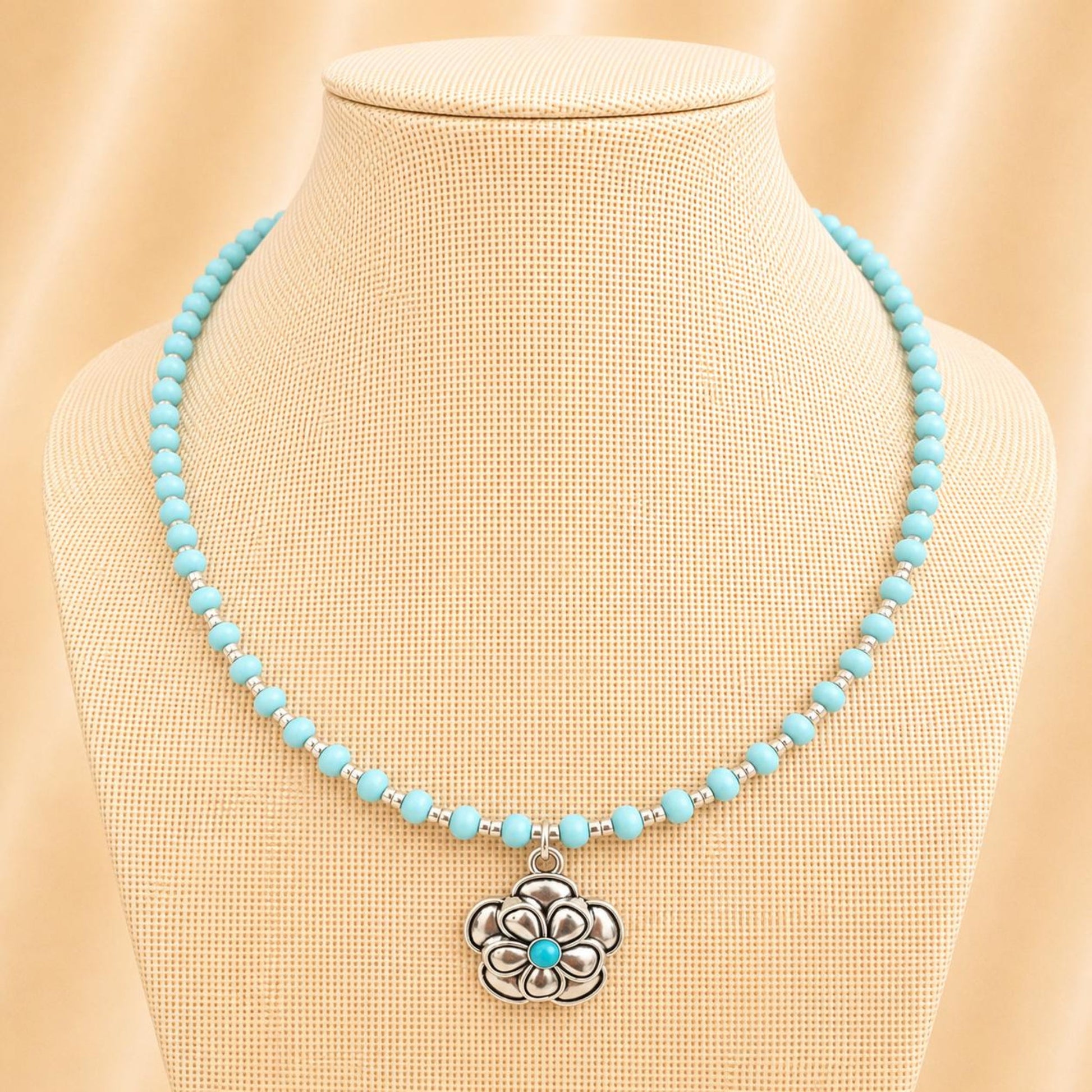 Handmade silver-blue blossom necklace with glass beads and silver flower pendant