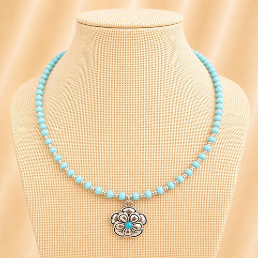 Handmade silver-blue blossom necklace with glass beads and silver flower pendant