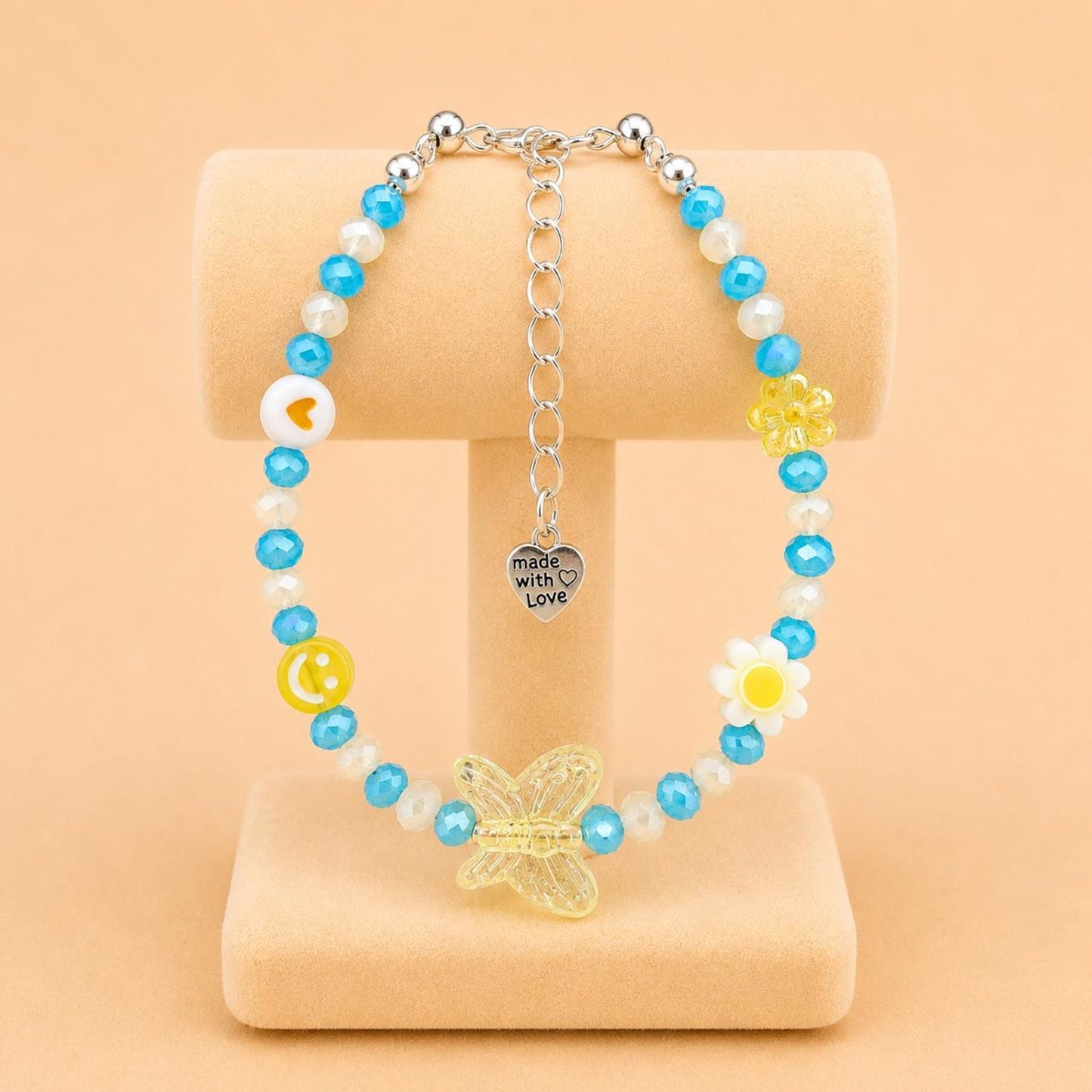 Colorful SUNNY DREAM handmade bracelet with blue, yellow, and white glass and acrylic beads on a stainless steel chain