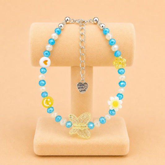 Colorful SUNNY DREAM handmade bracelet with blue, yellow, and white glass and acrylic beads on a stainless steel chain