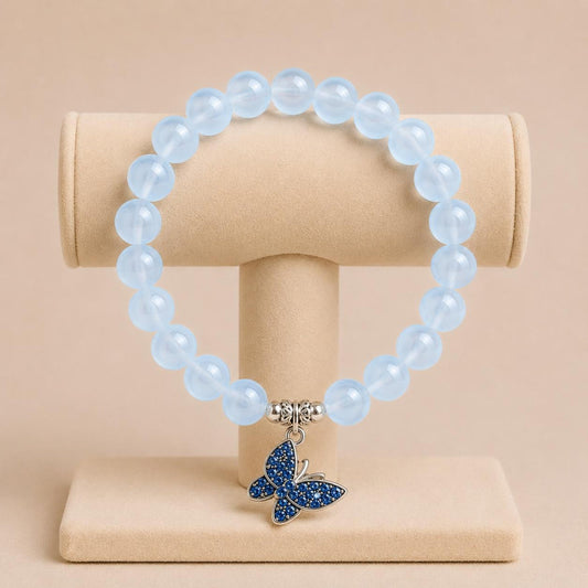 FREEDOM stretch bracelet with blue glass beads, silver spacers, and butterfly charm on elastic band