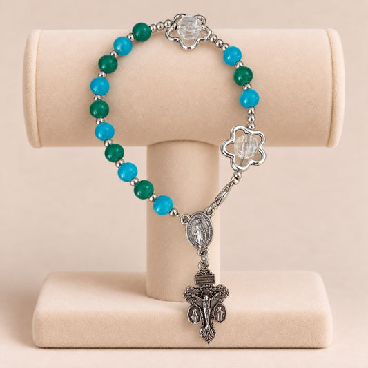 Ocean Bloom Handmade Rosary Bracelet with green and turquoise glass beads, silver-tone flower accents, centerpiece and crucifix