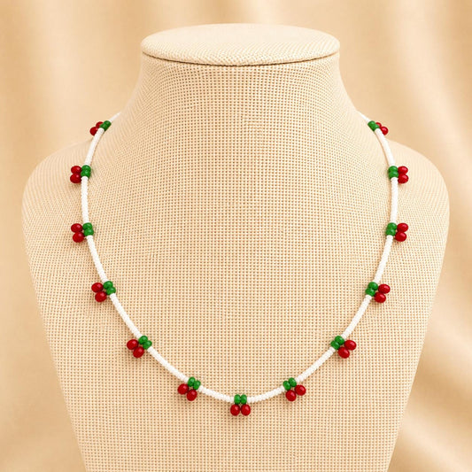Handmade CHERRY DELIGHT necklace with white, red, and green glass beads on stainless steel chain