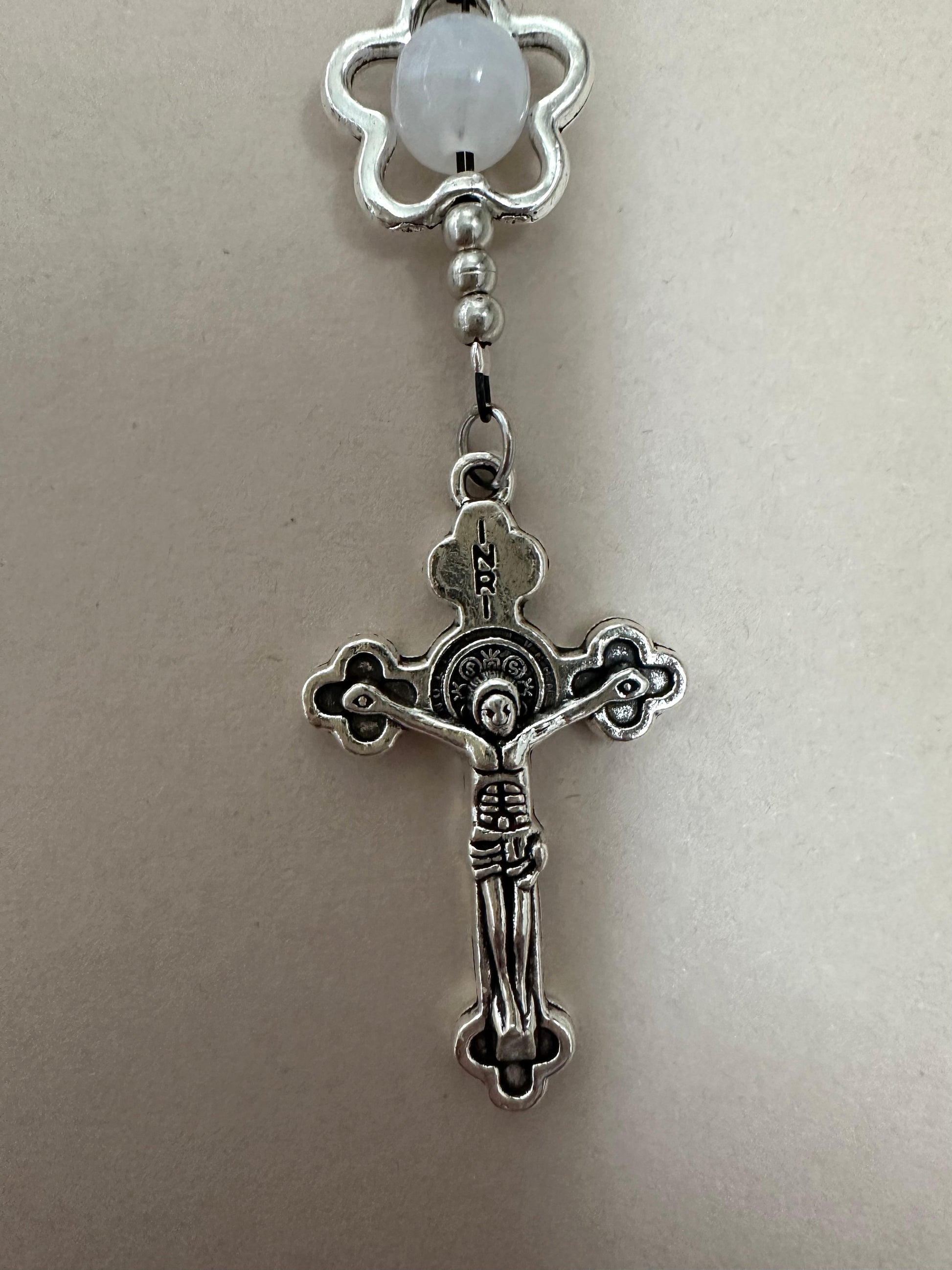 Midnight Bloom Handmade Rosary with black glass beads and silver-tone flower accents on a wooden background