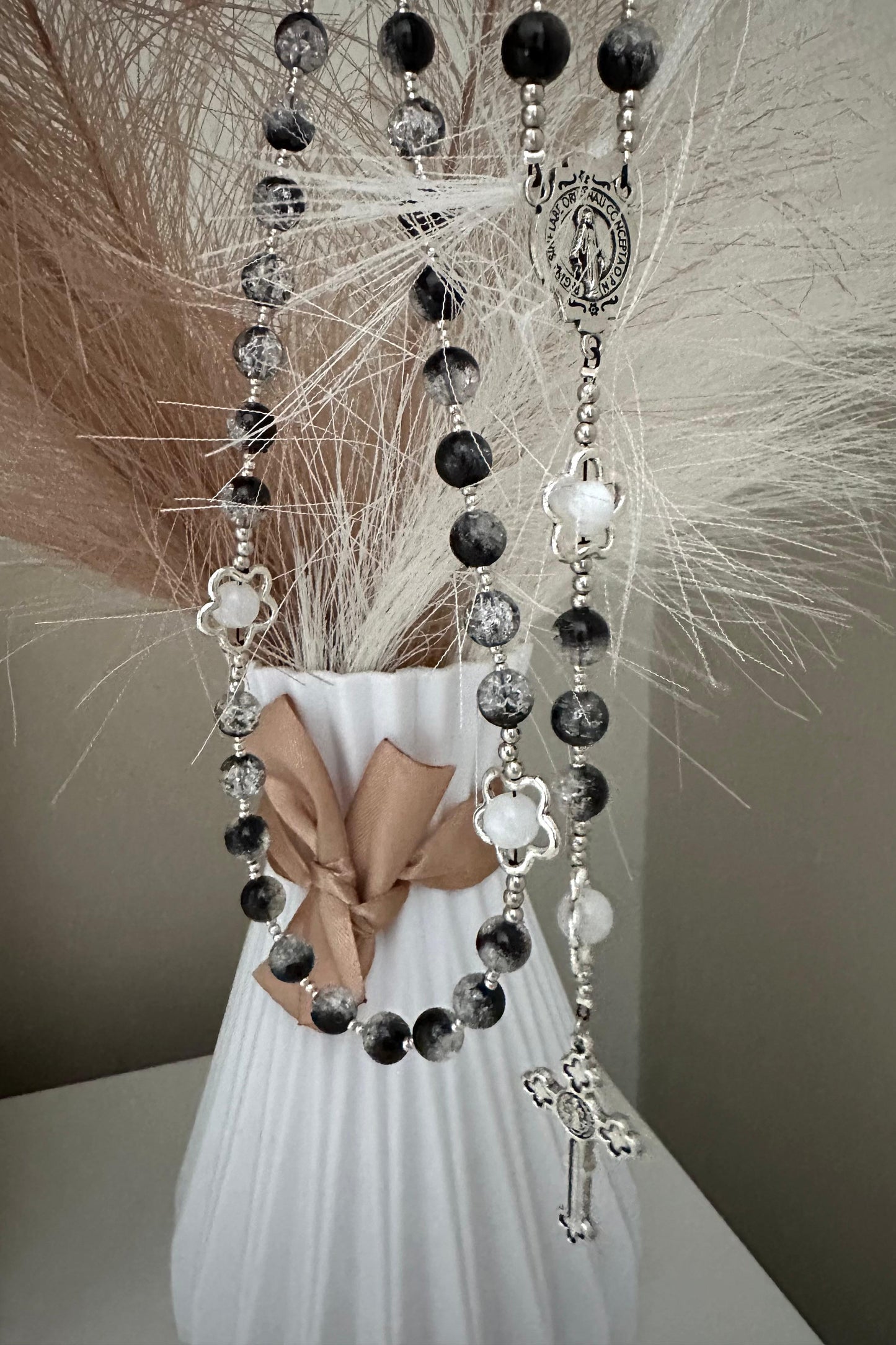 Midnight Bloom Handmade Rosary with black glass beads and silver-tone flower accents on a wooden background