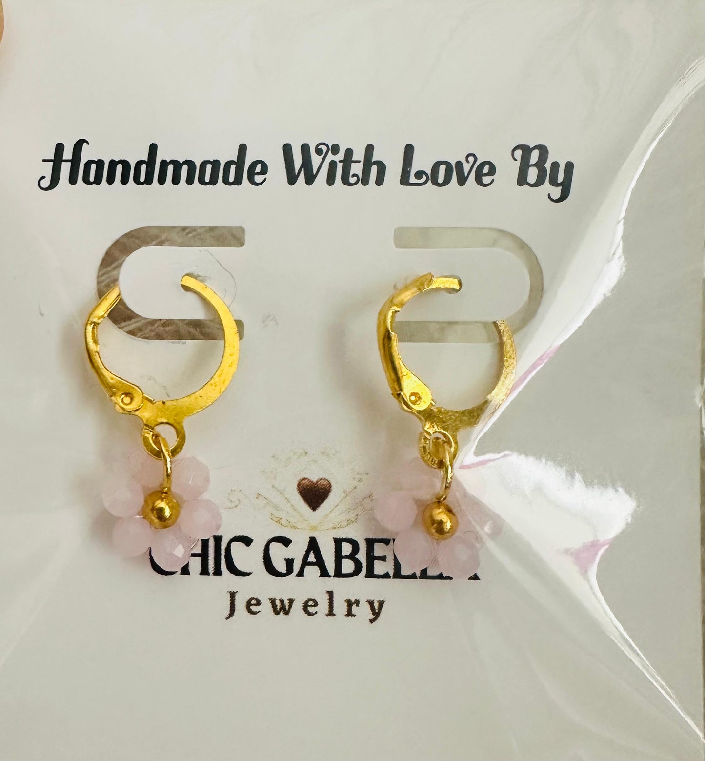 Handmade floral earrings with gold-tone accents and glass beads on leverback hoops