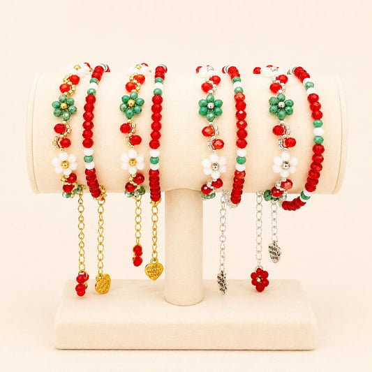 Christmas Vibe handmade bracelet pair in gold and silver with festive red, green, and white beads