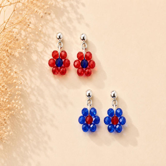 Handmade Daisy Bloom Silver Earrings with glass bead floral design and hypoallergenic stainless steel posts