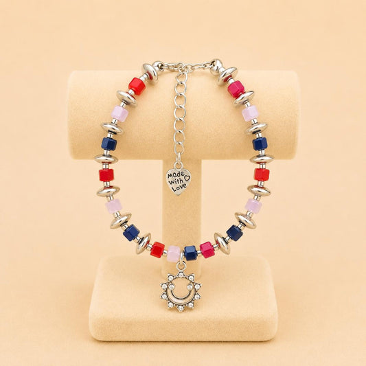 Handmade bracelet with silver smiley face pendant and colorful beads