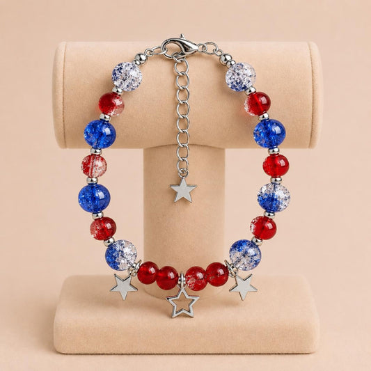 Handmade TWILIGHT STARS bracelet with blue and red glass beads, silver accents, and star charms on nylon string