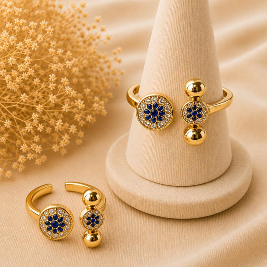 Adjustable stainless steel ring with royal blue floral crystals and 14K gold plating