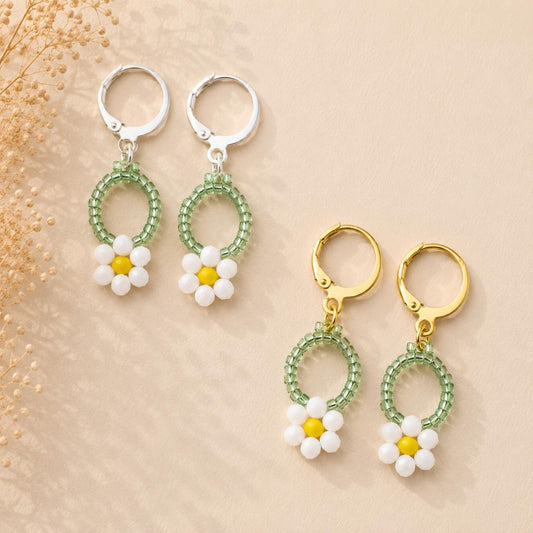 Handcrafted SUNNY DAISIES earrings with gold and silver stainless steel hoops, made with white, yellow, and green glass beads